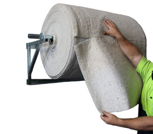 Absorbent roll matting on wall bracket dispenser